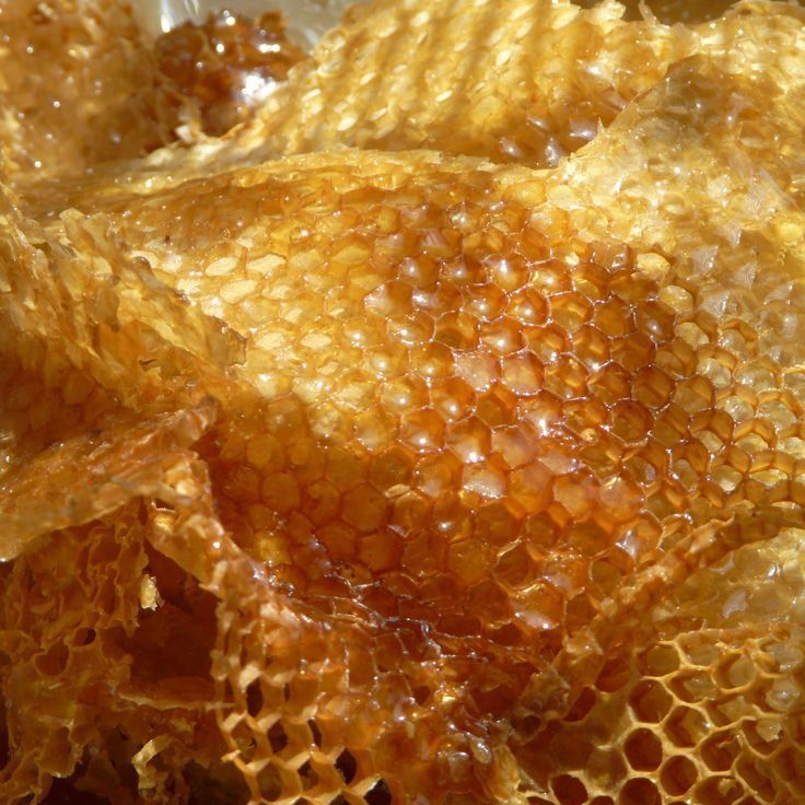 Close-up of golden beeswax, a key ingredient in Mirath Beauty’s tallow-based lip balm, providing natural water-resistance, skin barrier support, and nourishing, clean protection and hydration for chapped, dry lips