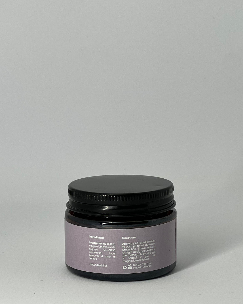 Back view of natural tallow deodorant jar  by Mirath Beauty showing ingredients, directions, and clean magnesium-based formula with grass-fed tallow for odor protection scented with musk al-tahara, made in Lebanon 