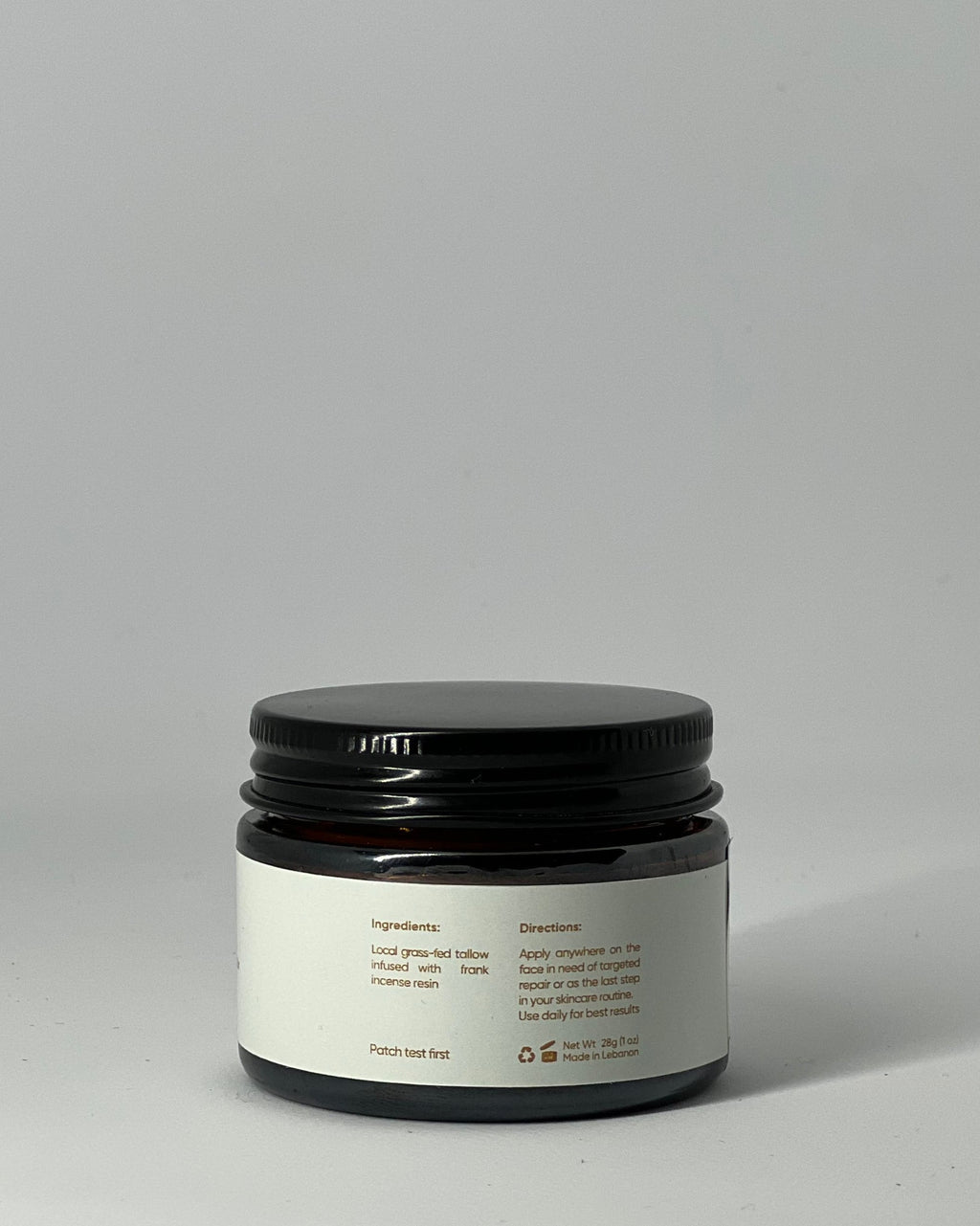 Back view of The Miracle tallow cream jar showing ingredients: grass-fed tallow and sacred frankincense resin , usage directions, patch test warning, net weight, recyclable packaging, and made in Lebanon - luxury antiaging skincare by Mirath Beauty