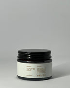 Back view of The Miracle tallow cream jar showing ingredients: grass-fed tallow and sacred frankincense resin , usage directions, patch test warning, net weight, recyclable packaging, and made in Lebanon - luxury antiaging skincare by Mirath Beauty