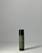 Back of tallow lip balm by Mirath Beauty, showing ingredients: grassfed tallow, olive oil, castor oil, beeswax, directions and clean unscented formulation for lip repair made in Lebanon