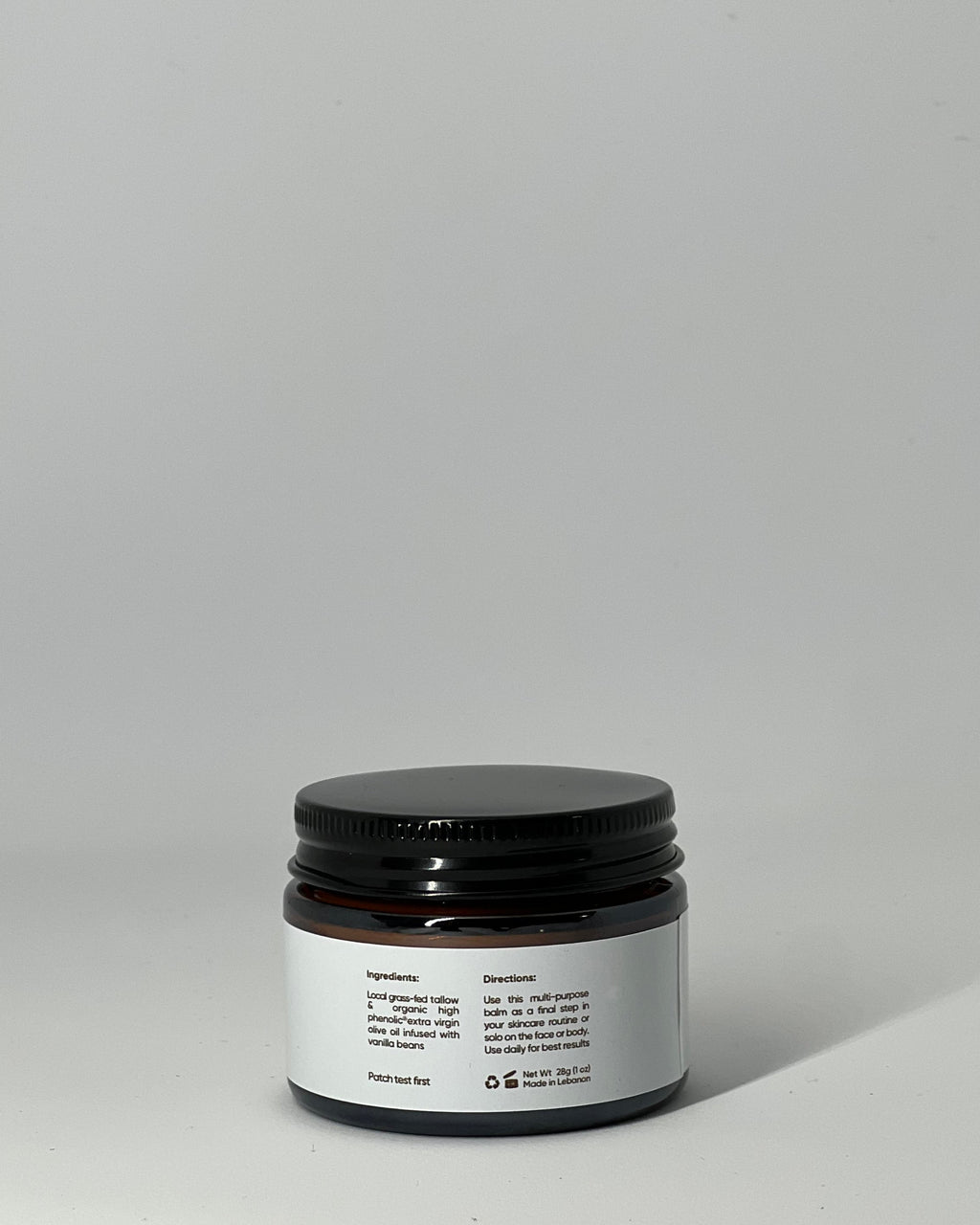 back view of The Simple One tallow cream jar showing ingredients: grass-fed tallow and high-phenolic olive oil, usage directions, patch test warning, net weight, recyclable packaging, and made in Lebanon - all-purpose skincare by Mirath Beauty.